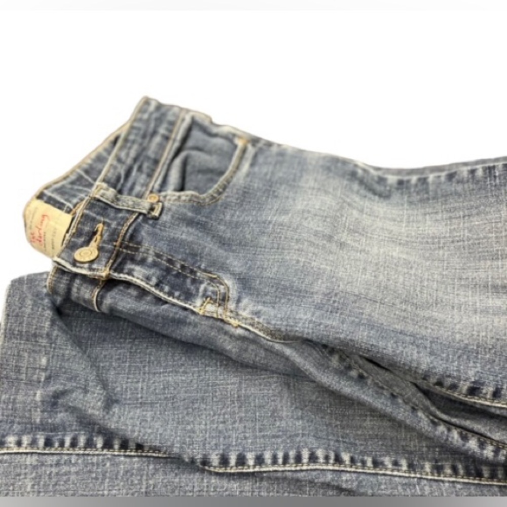 LIGH WASHED FLARED JEANS